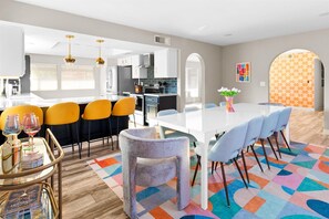 Experience the joy of togetherness in our open floor concept, where the kitchen and dining area seamlessly blend.