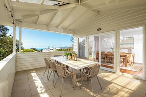 Outdoor patio with garden and ocean views