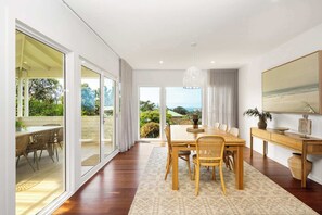 Dining room with ample seating for all guests and access to the outdoor patio for easy entertaining