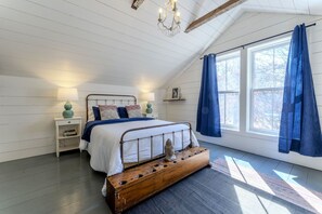 Upstairs queen bedroom overlooking the pool area.
