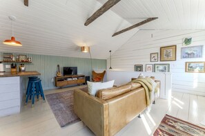 Natural sunlight fills the living room during the day.