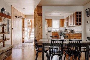 Entryway with dining area and kitchen