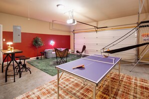 Game room with ping pong table, mini living room and basketball arcade game