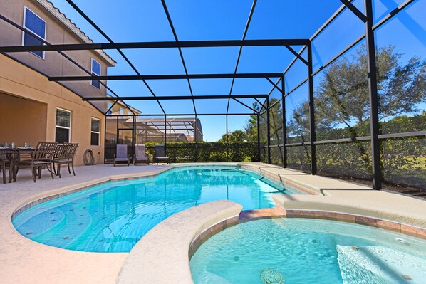 elax in a sparkling private pool under a screened patio—perfect for sunny days and cozy evenings!