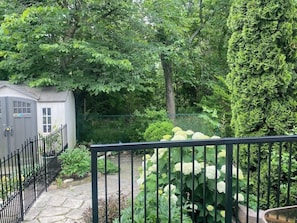 The backyard is divided between the homeowner and guests. Guests can enjoy their private section of the backyard and their own patio.