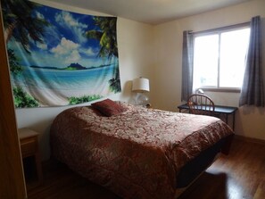 Bedroom 1 with queen bed and Roku smart TV