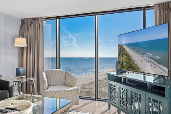 Living room with floor to ceiling windows
