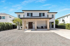 Front of house, with plenty of space for parking cars, boats or trailers.
