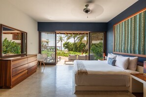 Wake up to breathtaking ocean views in this serene master suite, featuring floor-to-ceiling windows and direct terrace access.