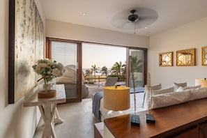 Wake up to spectacular ocean views in this spacious bedroom, featuring natural light and direct terrace access.
