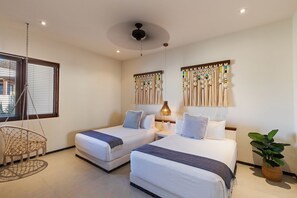 A cozy and inviting twin bedroom featuring warm lighting, handcrafted decor, and a peaceful atmosphere.