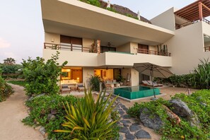 This exclusive beachfront villa boasts a private infinity pool, direct beach access, and lush tropical surroundings, creating the perfect luxury escape.