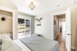 Main floor bedroom with slider to back patio