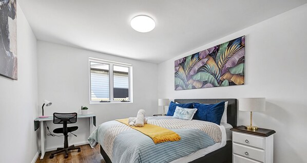 Bedroom with workspace area.