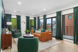 Bright and spacious living room off the kitchen. Smart TV, room darkening shades, and pull-out sleeper sofa for ultimate comfort.