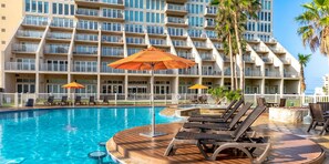 Shaded poolside loungers