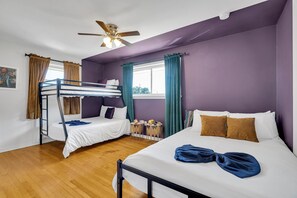 Spacious and fun, this colorful room sleeps up to five guests—ideal for families or groups looking to relax and recharge in style!