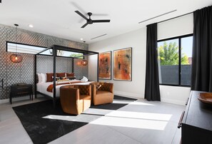 Primary Bedroom featuring a King bed, Designer furnishings, a Smart TV, and En-suite bathroom.
