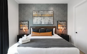 2nd Bedroom featuring a King Bed, Designer Furnishings, a Smart TV, and Walk-in Closet.