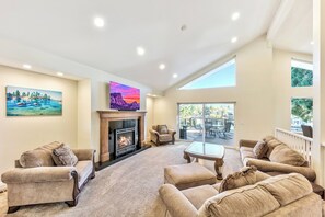 The large upstairs living room with gas fireplace and large HDTV is perfect for movie night