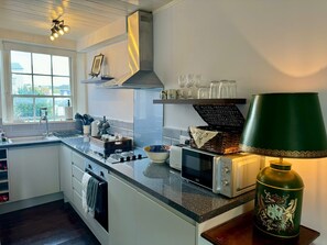 Kitchenette complete with dishwasher, oven, hob & microwave