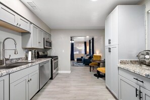 Fully equipped kitchen with modern appliances, perfect for home cooked meals