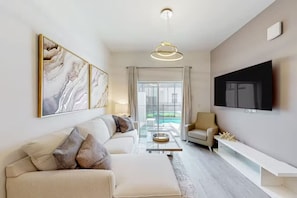 Cozy living space with a smart TV, perfect for movie nights or relaxation after a day of adventure.