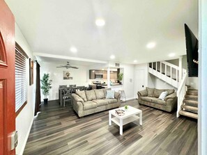 Comfort meets design in this cozy, well-lit living space.