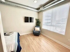 Snuggle up in this warm and welcoming bedroom sanctuary.