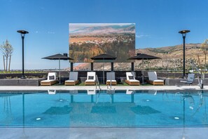 Year round rooftop swimming pool, 2 hot tubs and one HUGE JUMBOTRON for your entertainment.