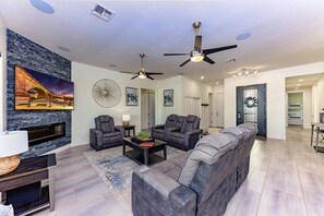 complete with comfy seating, a cozy fireplace, and a large TVcomplete with comfy seating, a cozy fireplace, and a large TV