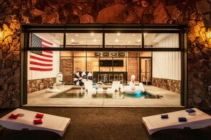 A private pool room with a garage door that opens!