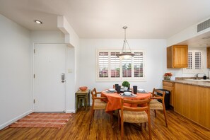 Dining table fits four comfortably, six when the leaves are put in.