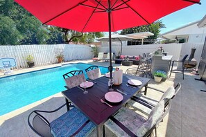 Outdoor dining, bar with mini fridge and outdoor lounging to enjoy