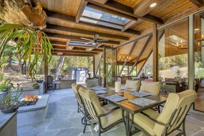 Peaceful back patio with outdoor seating and a fire pit