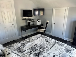 Work in comfort with a dedicated space: iMac, HP printer, office chair, desk, storage, and supplies.