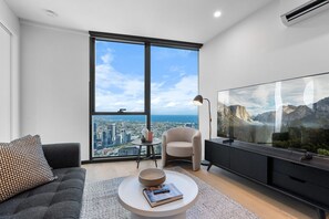 Small but fuctional living room with 65 inch Netflix enabled Smart TV