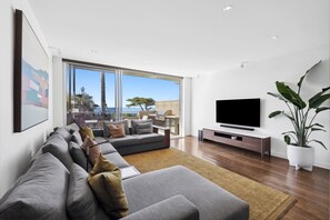 With comfortable seating, Smart TVs, and a seamless flow to the balconies, the living spaces are perfect for relaxing after a day of exploring