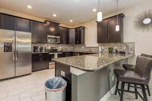 The kitchen is equipped with quality appliances and everything you’d need to prepare meals at home