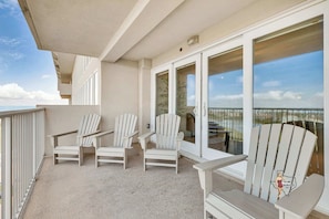Unwind on the balcony, complete with cozy Adirondack chairs and stunning views of the surrounding landscape.