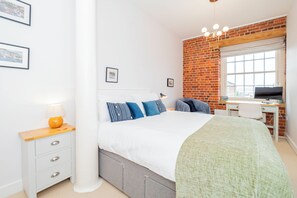 Rest in comfort on the king size bed, or get some work done at the included workspace