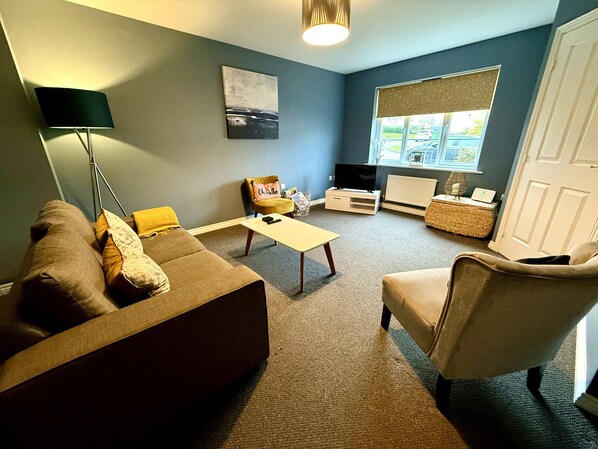 Living Room: Bright space with comfy seating and stylish decor for perfect relaxation!