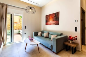 House 1: Living room with comfortable double sofa bed