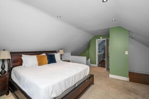 The serene third-floor king suite boasts a private en suite & Smart TV