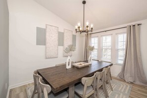 Gather family around the dining table, with seating for 10