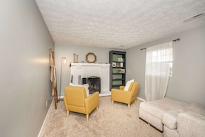 Escape to the lower-level den & kick back with a book