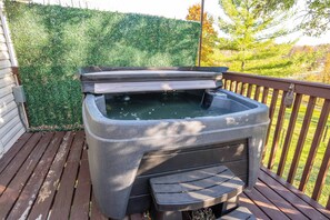 Soak all your cares away in the private hot tub on the back deck