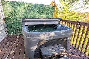 Soak all your cares away in the private hot tub on the back deck