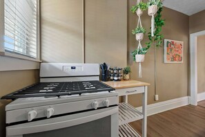 The breezy kitchen offers loads of storage space & every home comfort