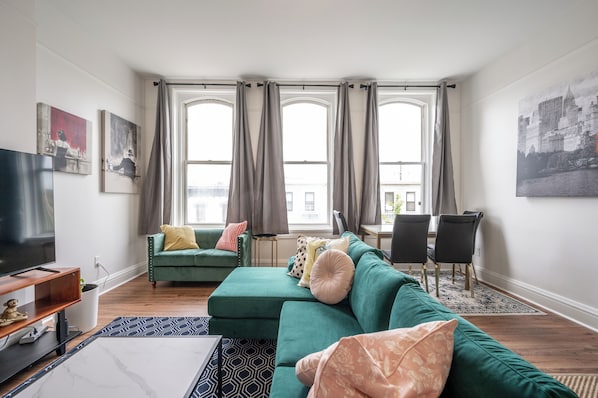 Cozy and spacious living area with TV